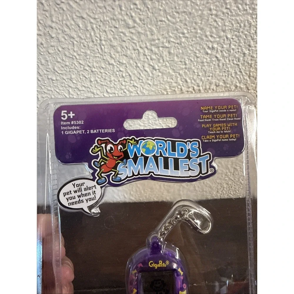 Worlds Smallest GigaPets Virtual Pet Pixel Puppy Giga Pet Electronic Purple Dog